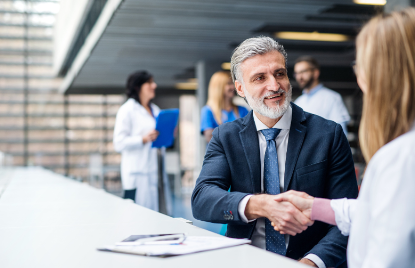 Image of a personal injury attorney and a medical professional meeting.